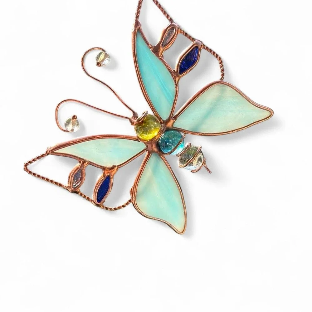 Blue stained glass butterfly suncatcher with copper wire frame and glass orbs